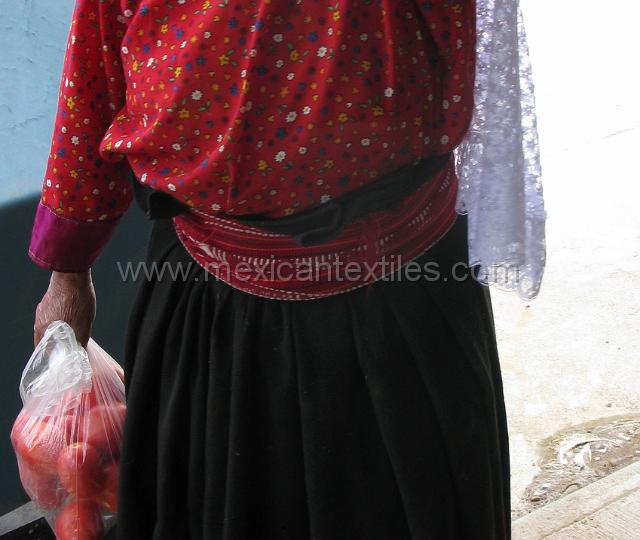 belt_chicometepec_13.JPG - These red belts are similar in design to the Totonacan belts worn in nearby communities. It is entirely possible that these peoples are Totonacan who were taught to speak Nahuatl , or rather forced . The heavey wool skirt are useful because it is cool there much of the year because of the altitude.